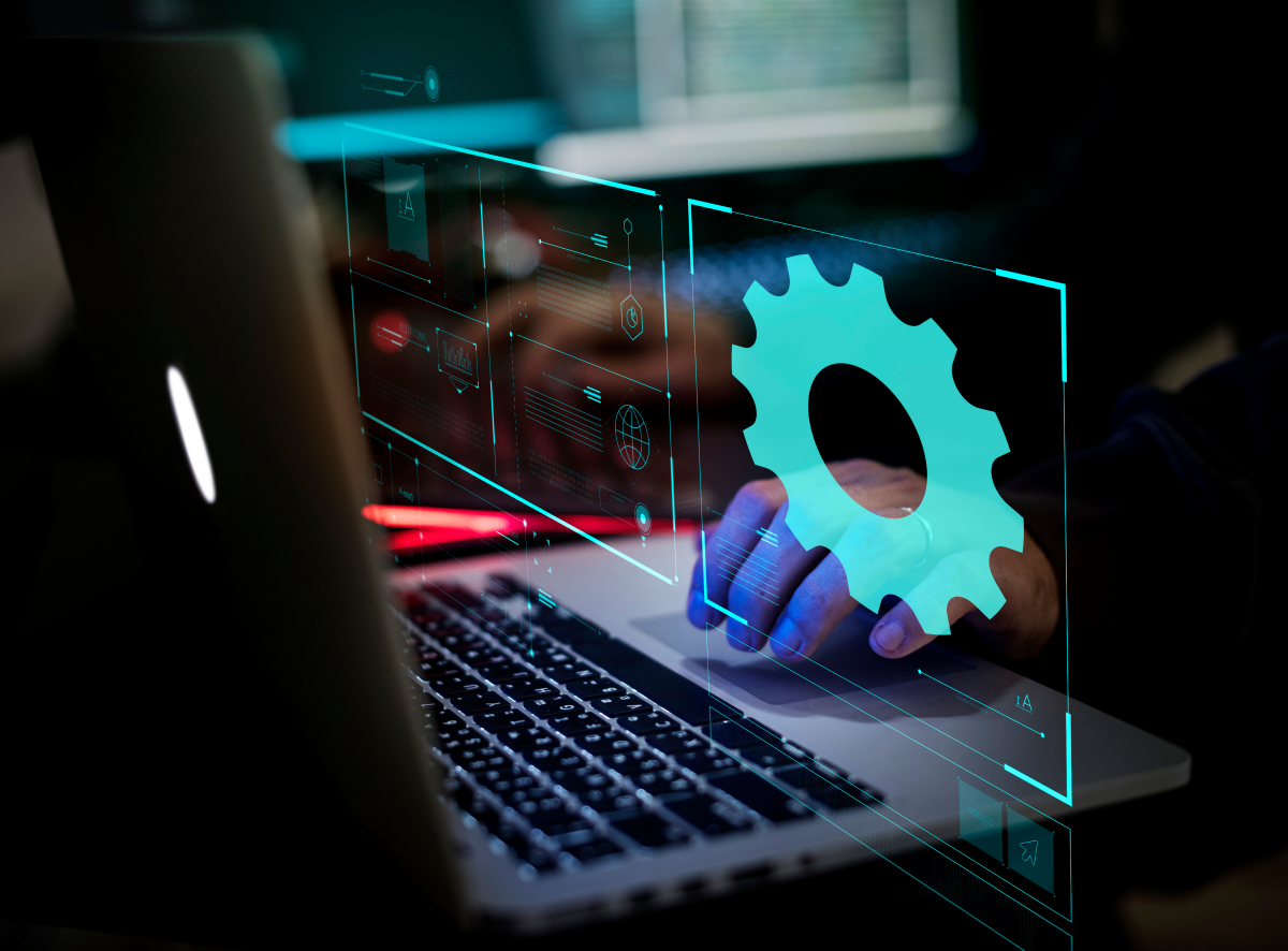 Interface numérique illustrant l’intelligence artificielle comme un outil neutre, symbolisée par un engrenage lumineux devant un ordinateur, reflétant le choix humain entre peur et conscience.